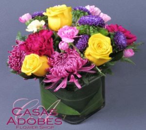 pink and purple mums with yellow roses and cube vase